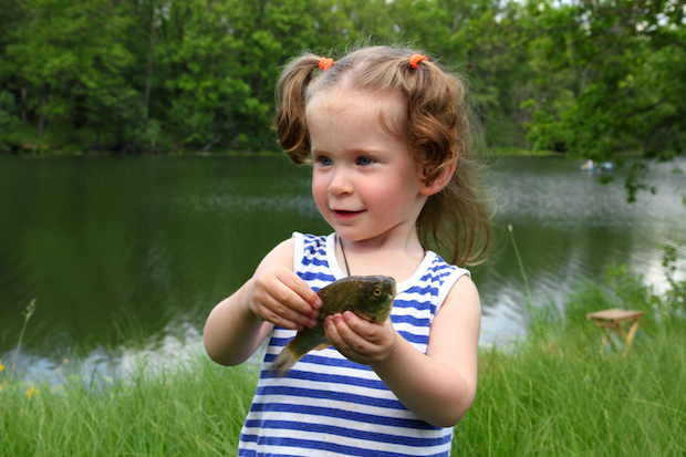 fishing - littlle girl with catching fish